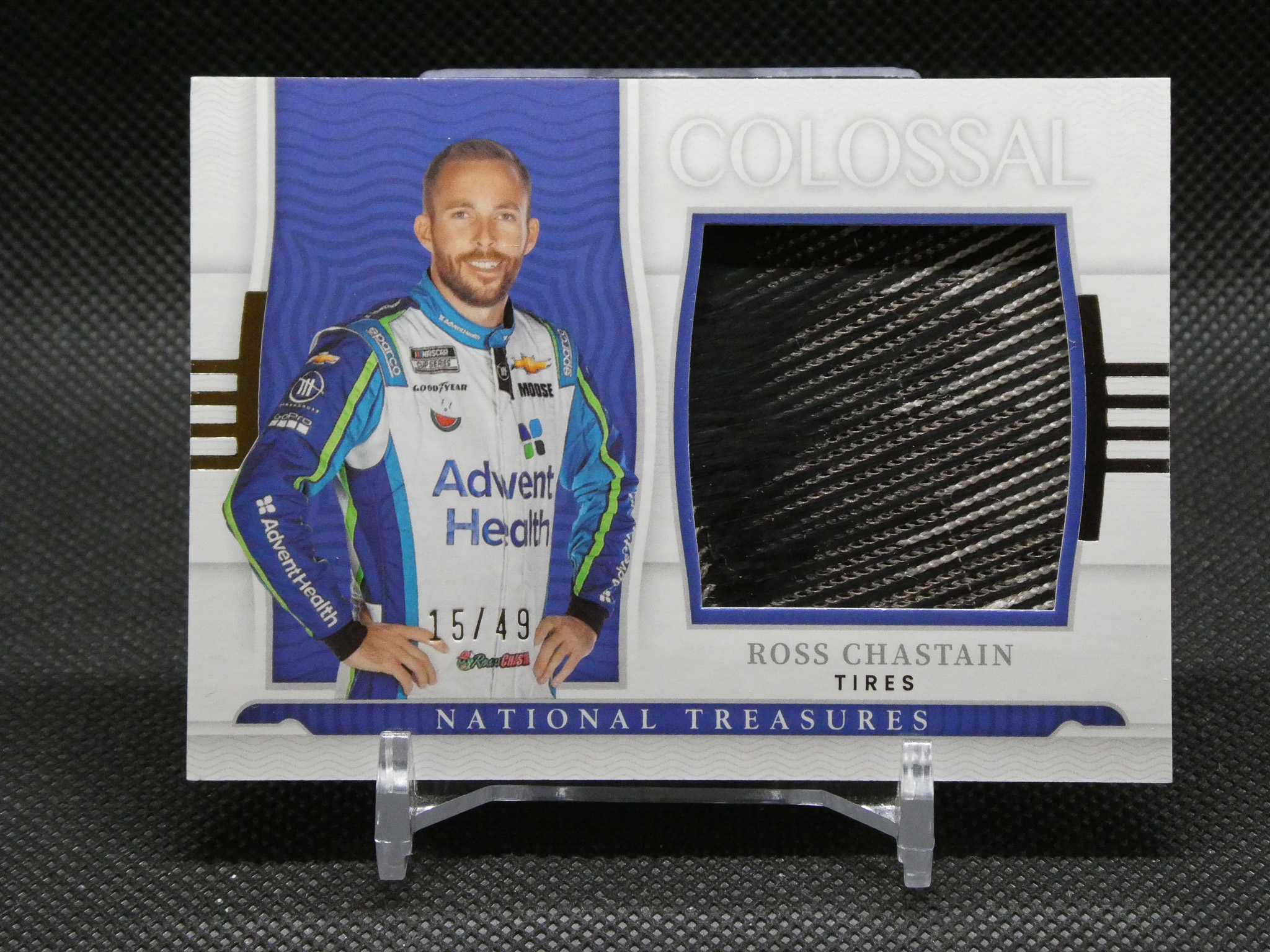 Trading card featuring NASCAR driver Ross Chastain in a blue racing suit, showing 15/49 and National Treasures branding.