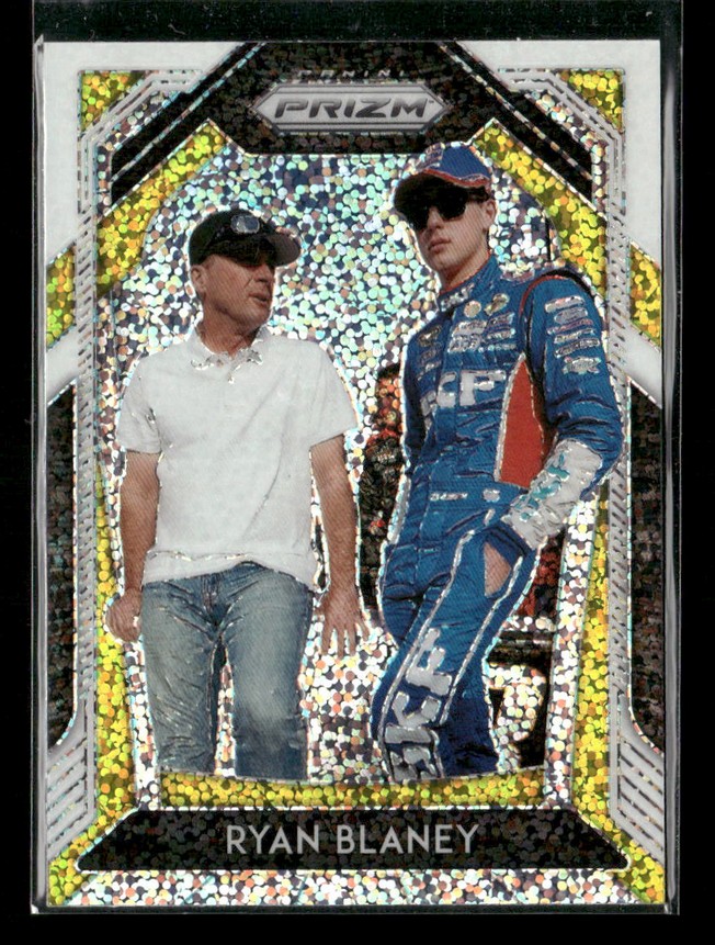 Holographic trading card showing Ryan Blaney in a blue racing suit with a man in a white polo, Prizm branding at top and 'Ryan Blaney' at bottom