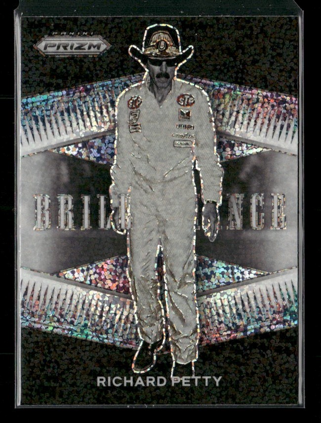 Trading card showing NASCAR legend Richard Petty in a white racing suit and cowboy hat, with a holographic background and Panini Prizm branding.