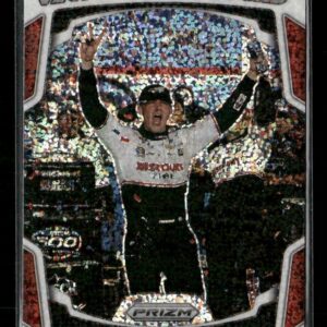 Austin Cindric celebrates in Victory Lane with arms raised as confetti rains down behind him, on a Prizm trading card.