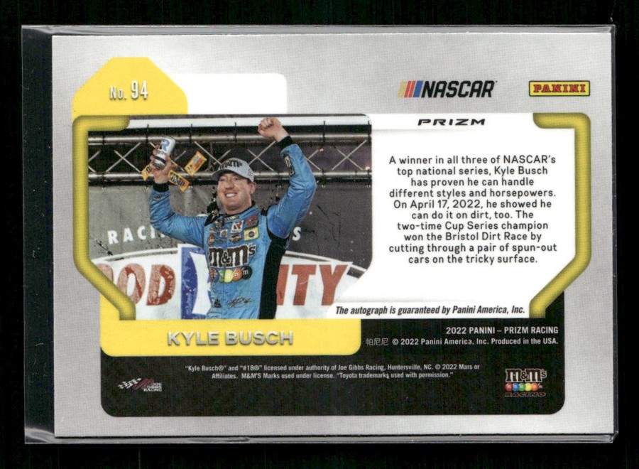 Panini NASCAR Prizm trading card showing a blue-suited race driver on a victory stage, arms raised in celebration, with logos and a 'No. 94' label.