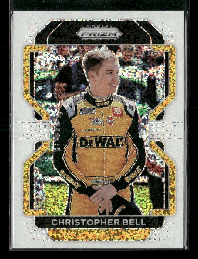 Trading card featuring NASCAR driver Christopher Bell in a yellow DeWalt racing suit with a holographic border.