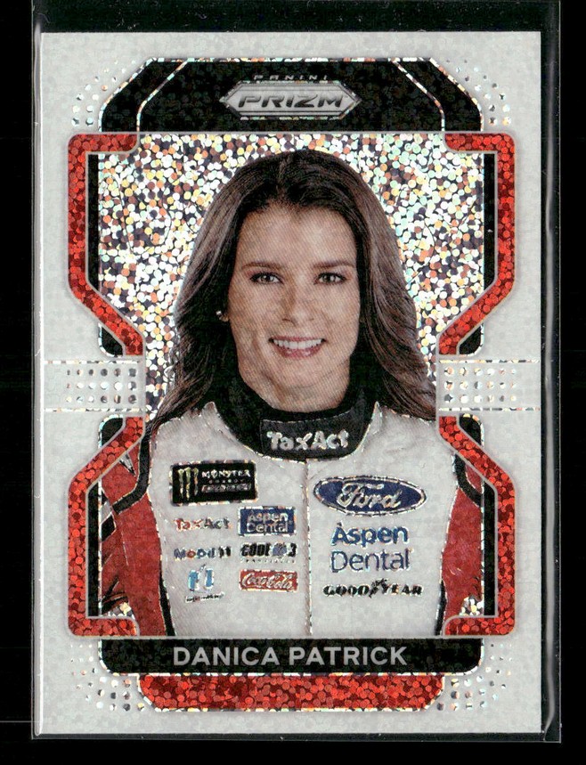 Portrait of a smiling female race car driver on a glittery trading card with sponsor logos on her white racing suit, red frame behind.
