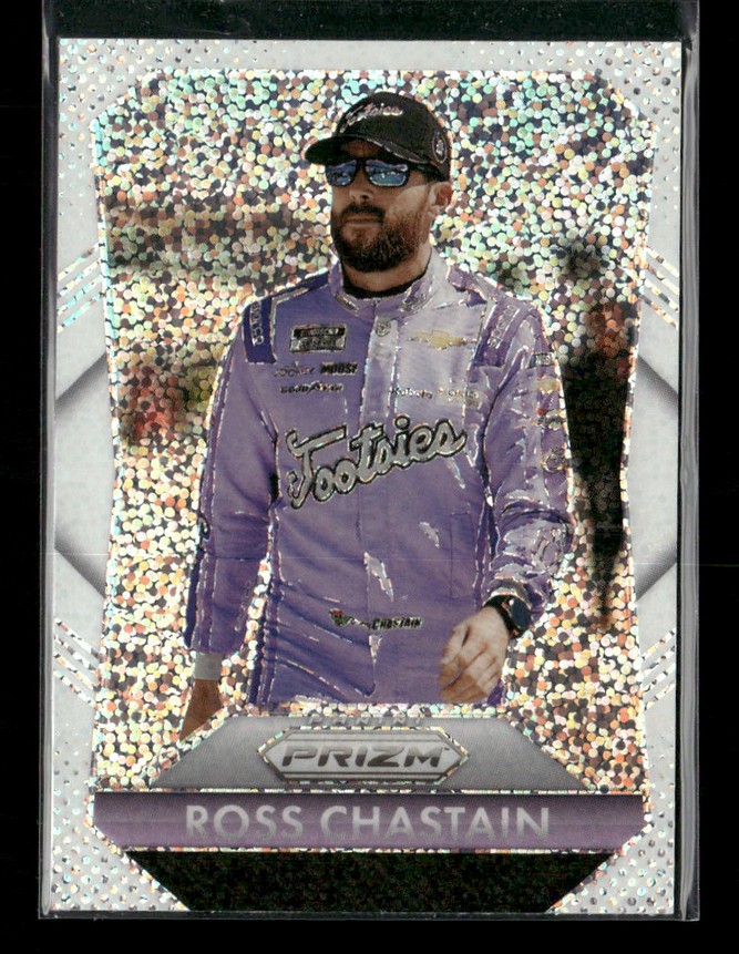Trading card of a race car driver in a purple racing suit, with a holographic speckled background and a Prizm logo at the bottom.