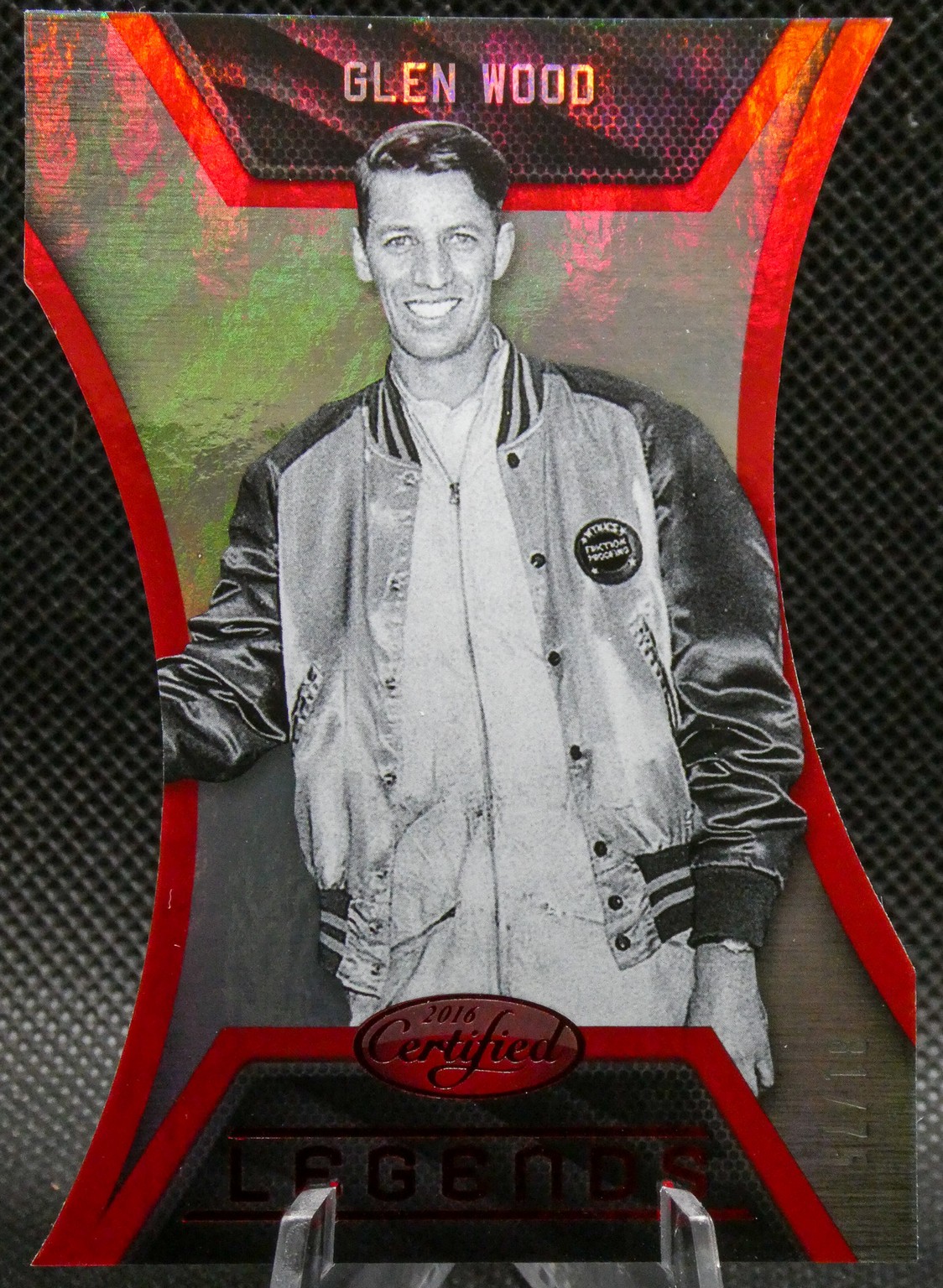Glen Wood Legends trading card with a black-and-white photo of a smiling man in a varsity jacket on a red and black background.