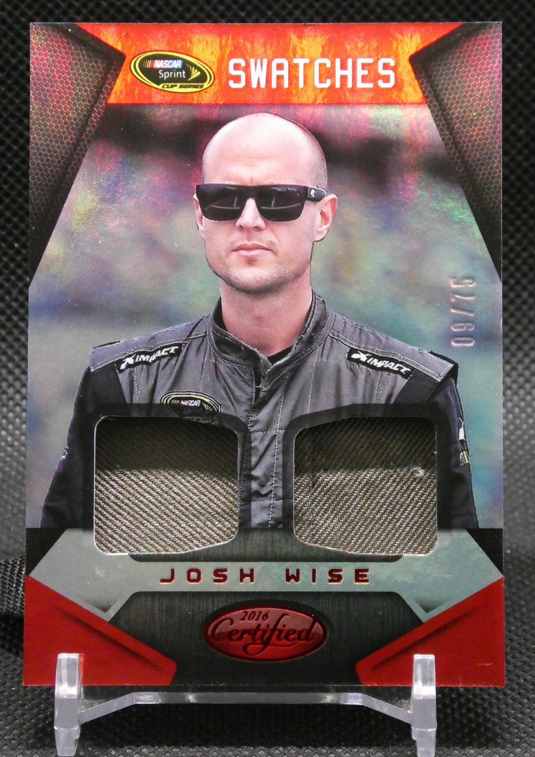 Josh Wise NASCAR trading card titled Swatches, featuring two fabric swatches worn by the driver.