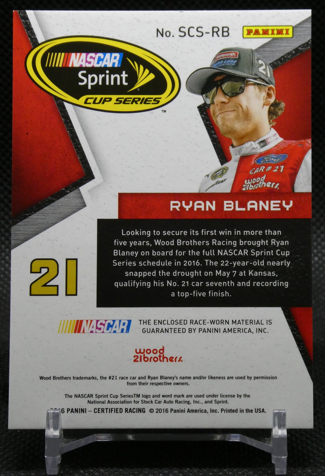 NASCAR Sprint Cup Series trading card of Ryan Blaney (#21): portrait with cap and sunglasses, Panini logo and bio text panel.