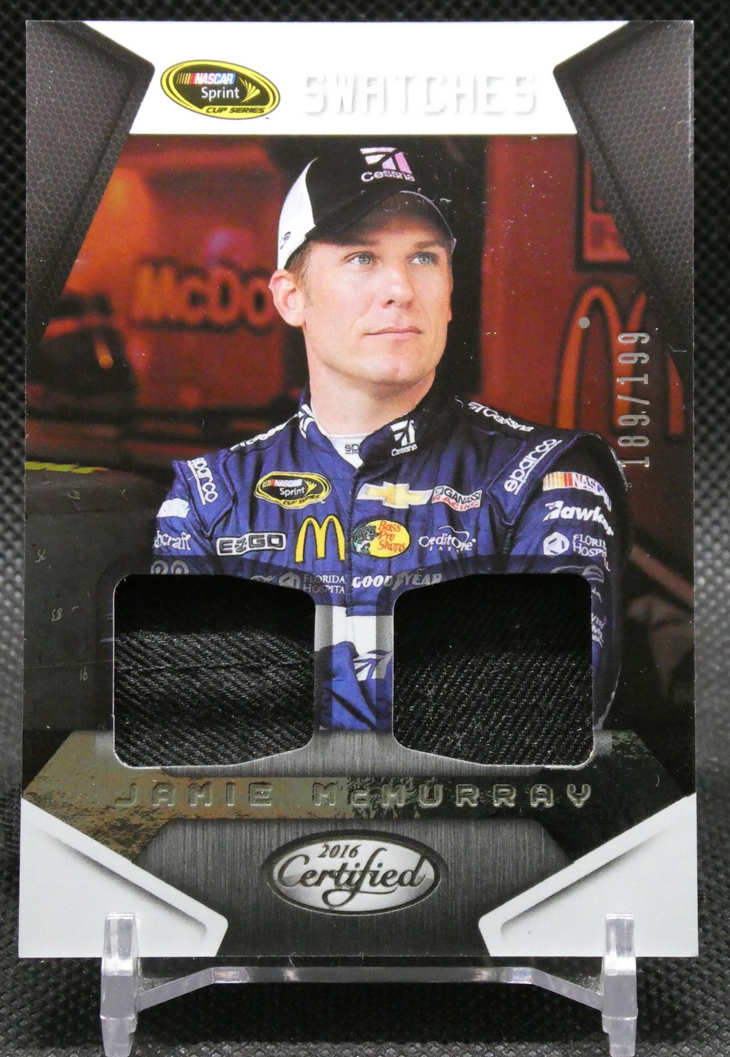 Jamie McMurray in a blue sponsor-laden racing suit, portrait on a NASCAR trading card with sponsor logos and 'Certified 2016' badge.
