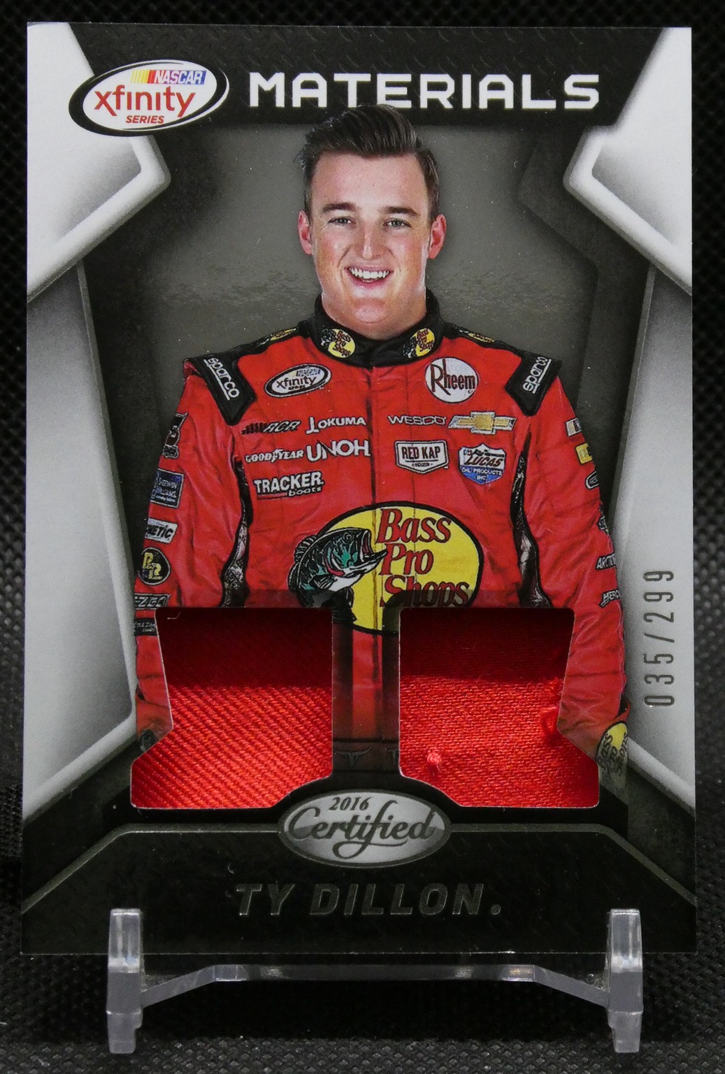 NASCAR trading card of Ty Dillon in a red Bass Pro Shops race suit, with two red fabric swatches and the 2016 Certified logo at the bottom.