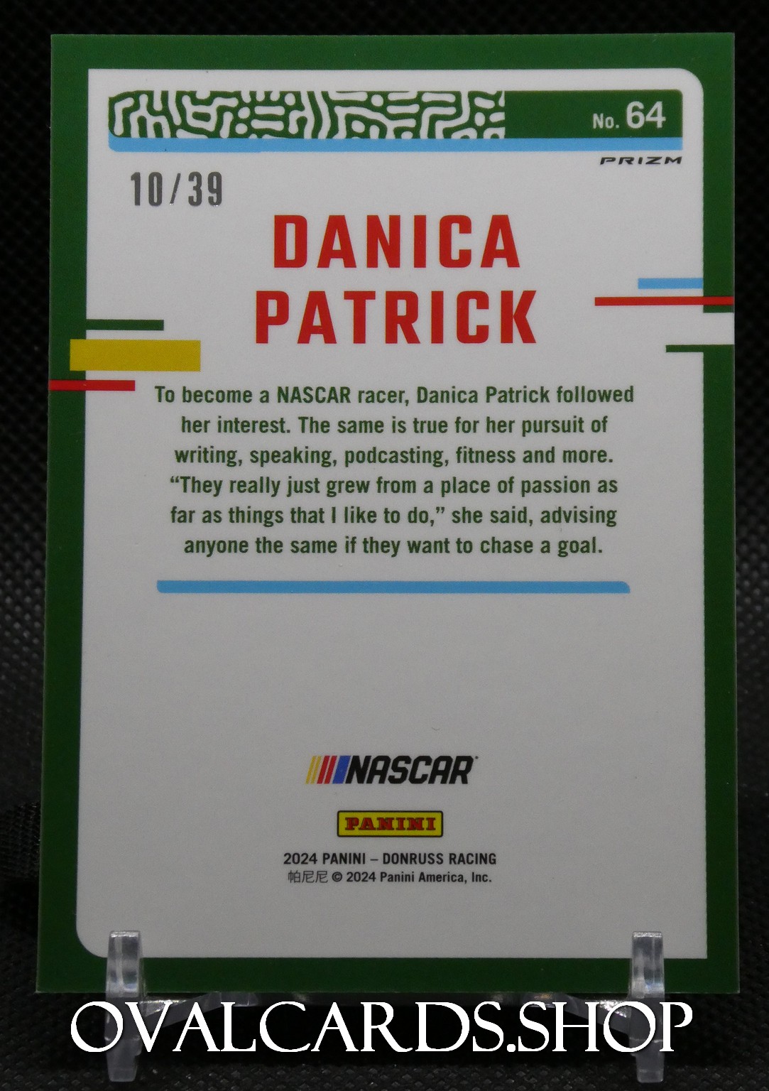 Trading card front featuring Danica Patrick in bold red letters, green border, and NASCAR Panini branding; labeled 10/39 with a blue accent stripe.