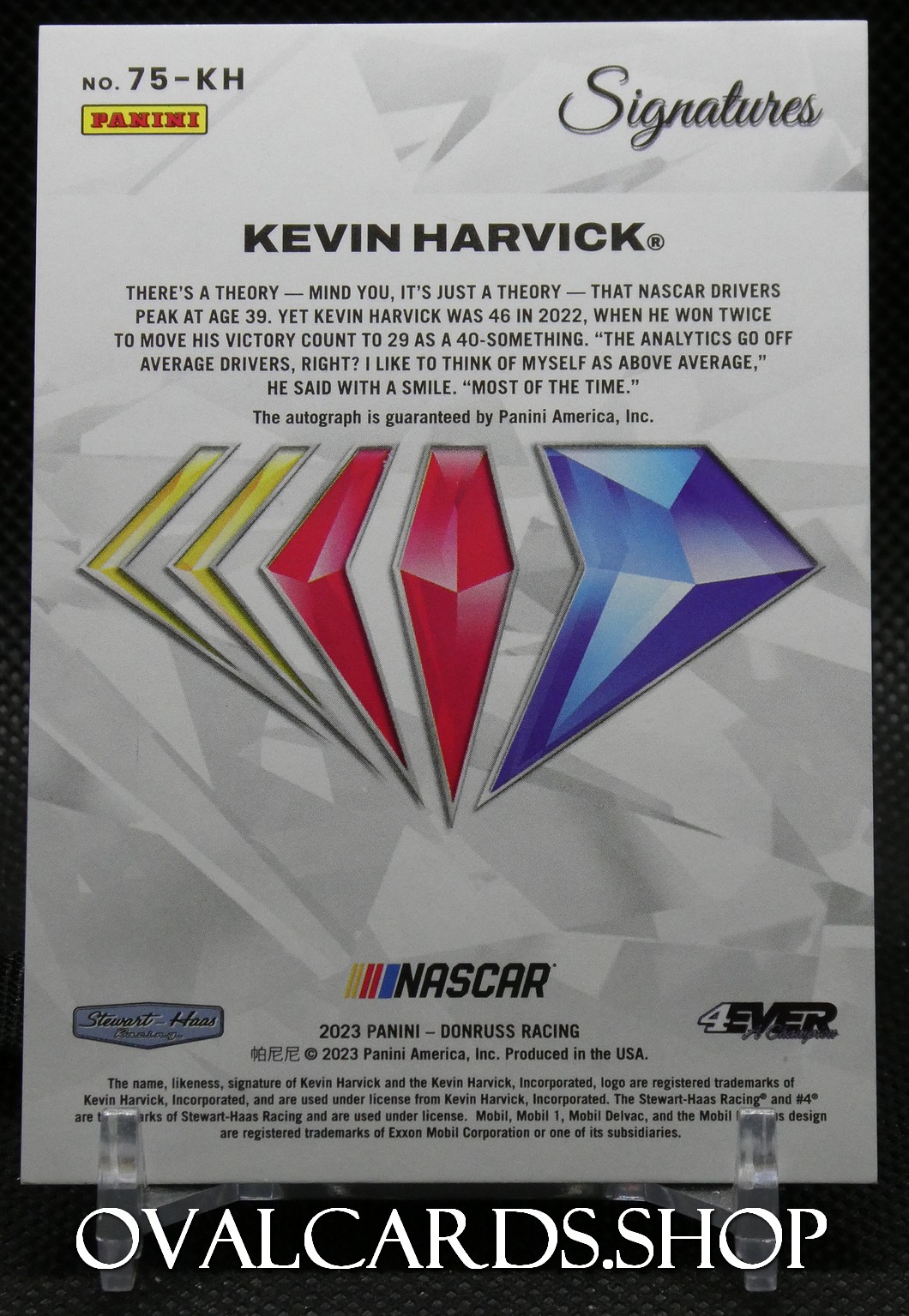 Back of a Kevin Harvick Panini Signatures card with multicolored diamond logo and NASCAR branding.