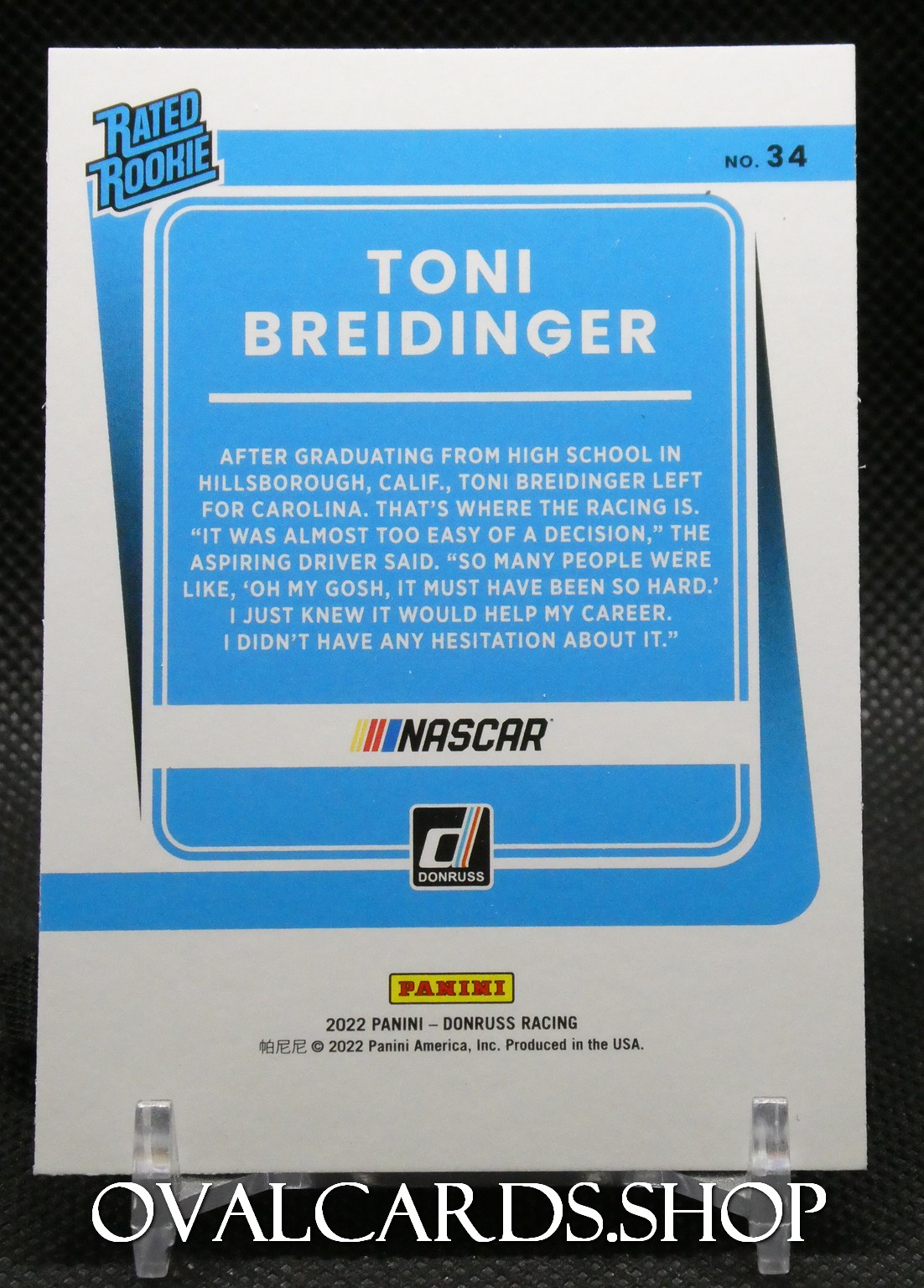 Blue trading card back for Toni Breidinger (No. 34) from NASCAR Donruss Panini, with a bio paragraph and logos.