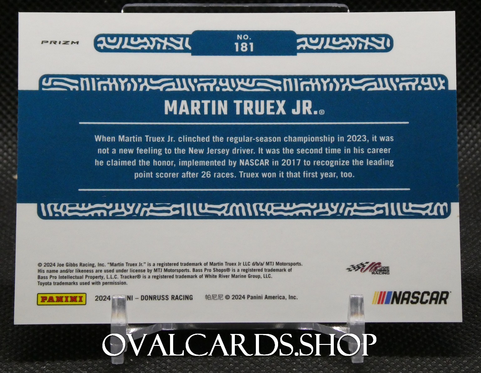 Martin Truex Jr. trading card insert with blue decorative banner and NASCAR logos on the back panel.