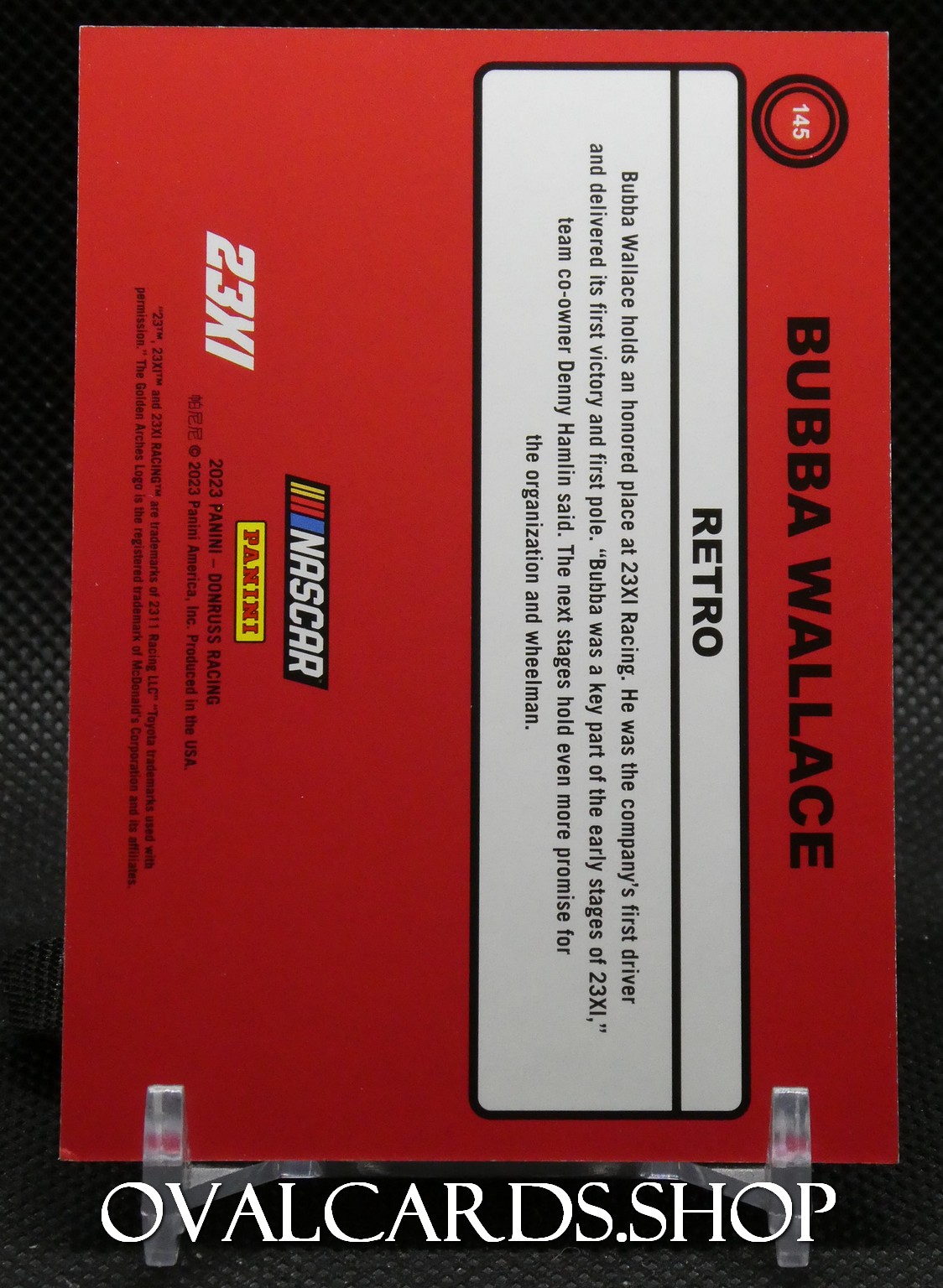 Red Bubba Wallace NASCAR trading card box with 'RETRO' label and 23XI Racing logos; includes Panini and Oval Cards branding on left.