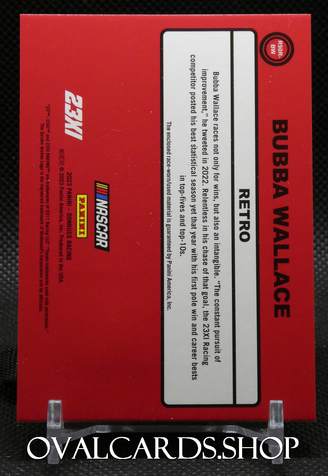 Red packaging featuring Bubba Wallace NASCAR Retro 1:24 scale die-cast box, with bold black text and Panini/NASCAR logos visible on the side.