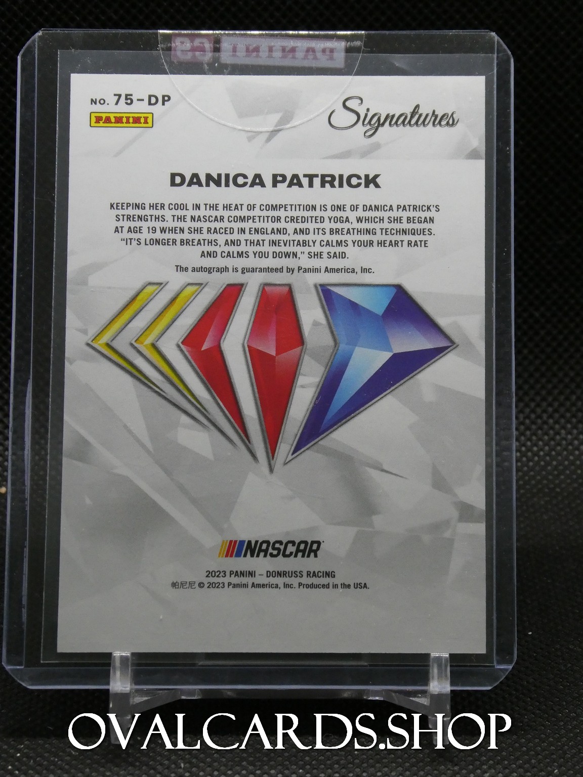 Panini Signatures trading card for Danica Patrick in a protective plastic case, featuring a multicolored diamond logo and NASCAR branding.
