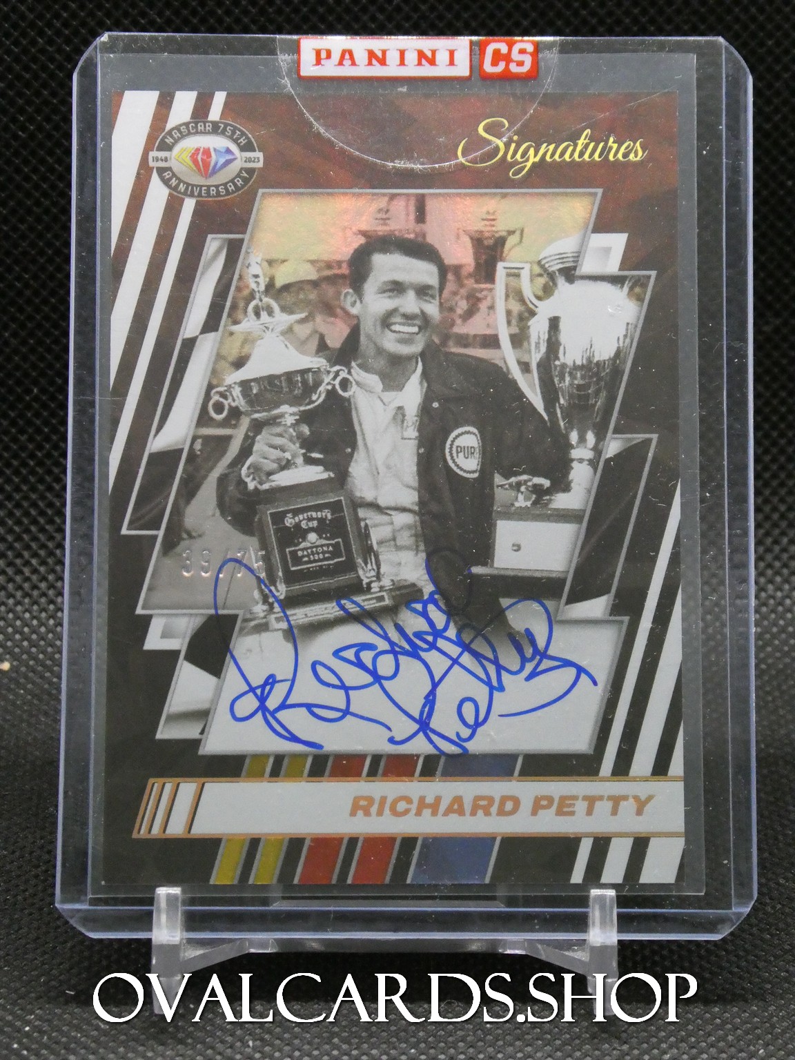 Panini CS Signatures trading card featuring Richard Petty smiling with a trophy; blue autograph across the image.