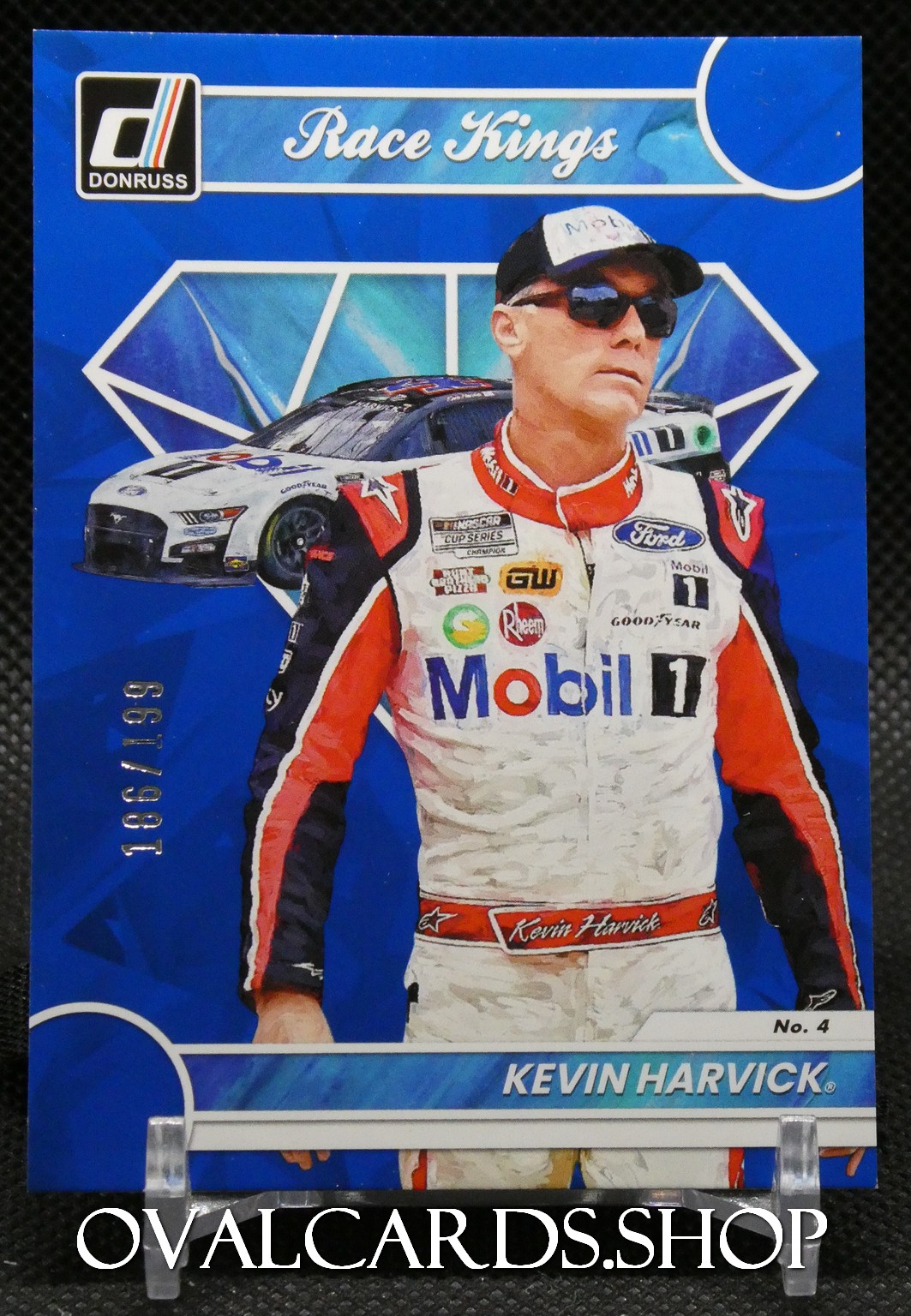 Trading card featuring NASCAR driver Kevin Harvick in a Mobil 1 suit with a race car in the blue background, Donruss logo, and 'Race Kings' heading