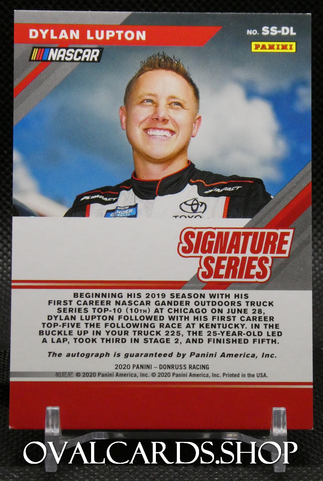 Panini NASCAR trading card featuring Dylan Lupton in a race suit, smiling, with 'Signature Series' branding visible.