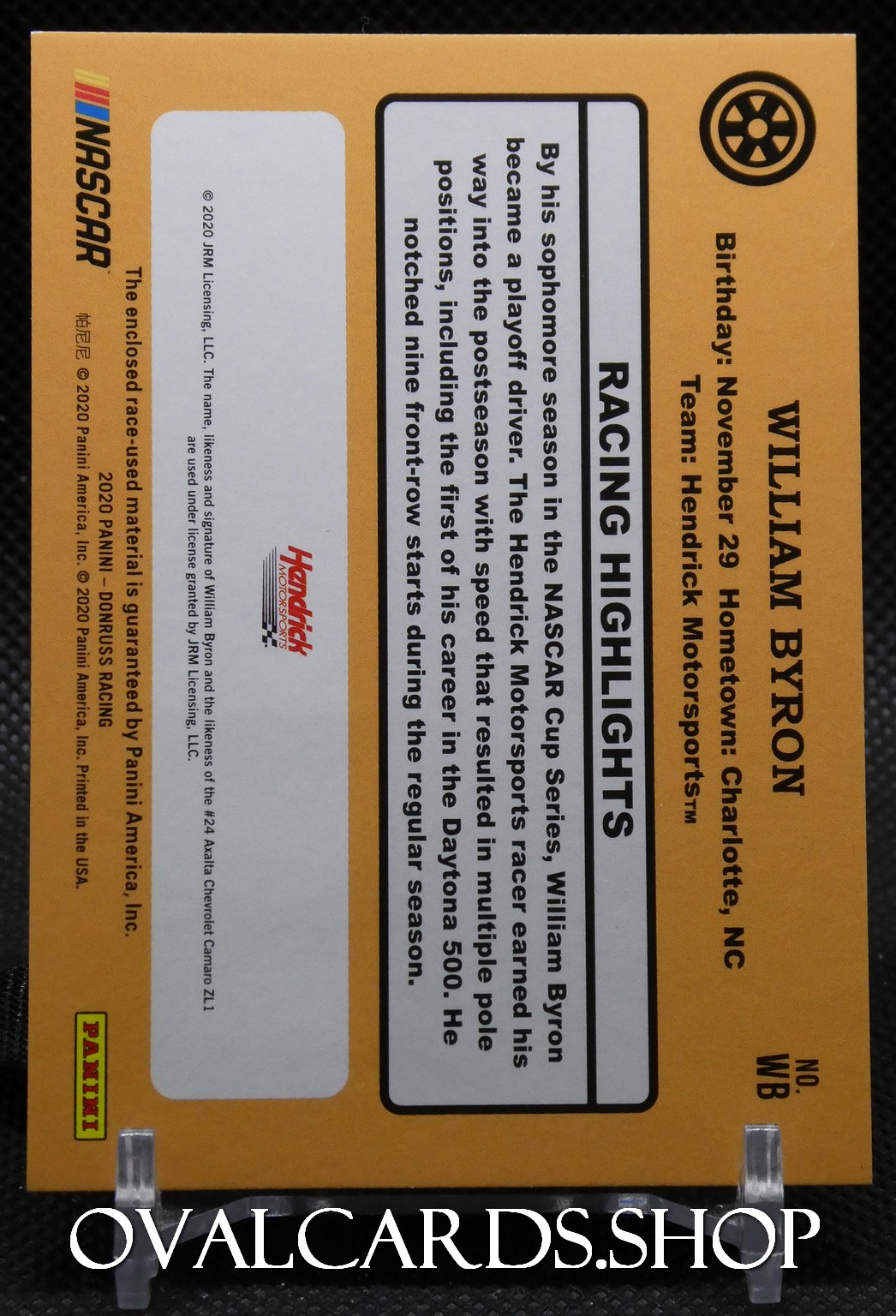 Orange NASCAR card for William Byron with biography and racing highlights panels; left shows NASCAR logo, right lists birthday and team info, wheel icon top right.
