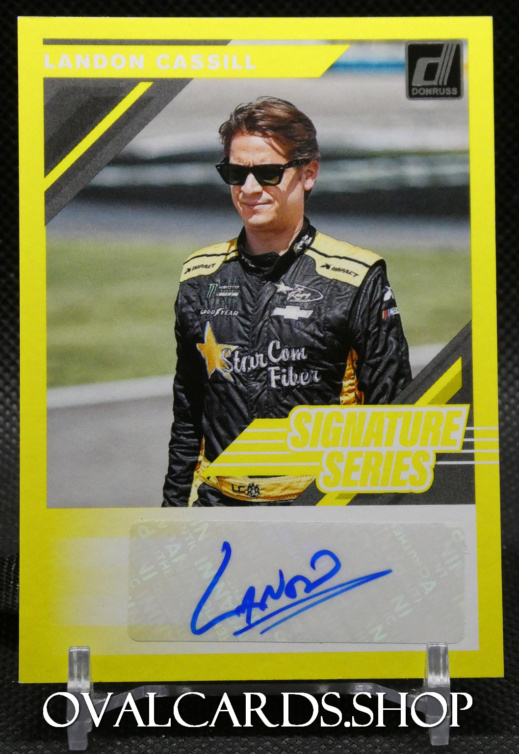 Landon Cassill Donruss Signature Series trading card with a bright yellow border and a blue autograph at the bottom.