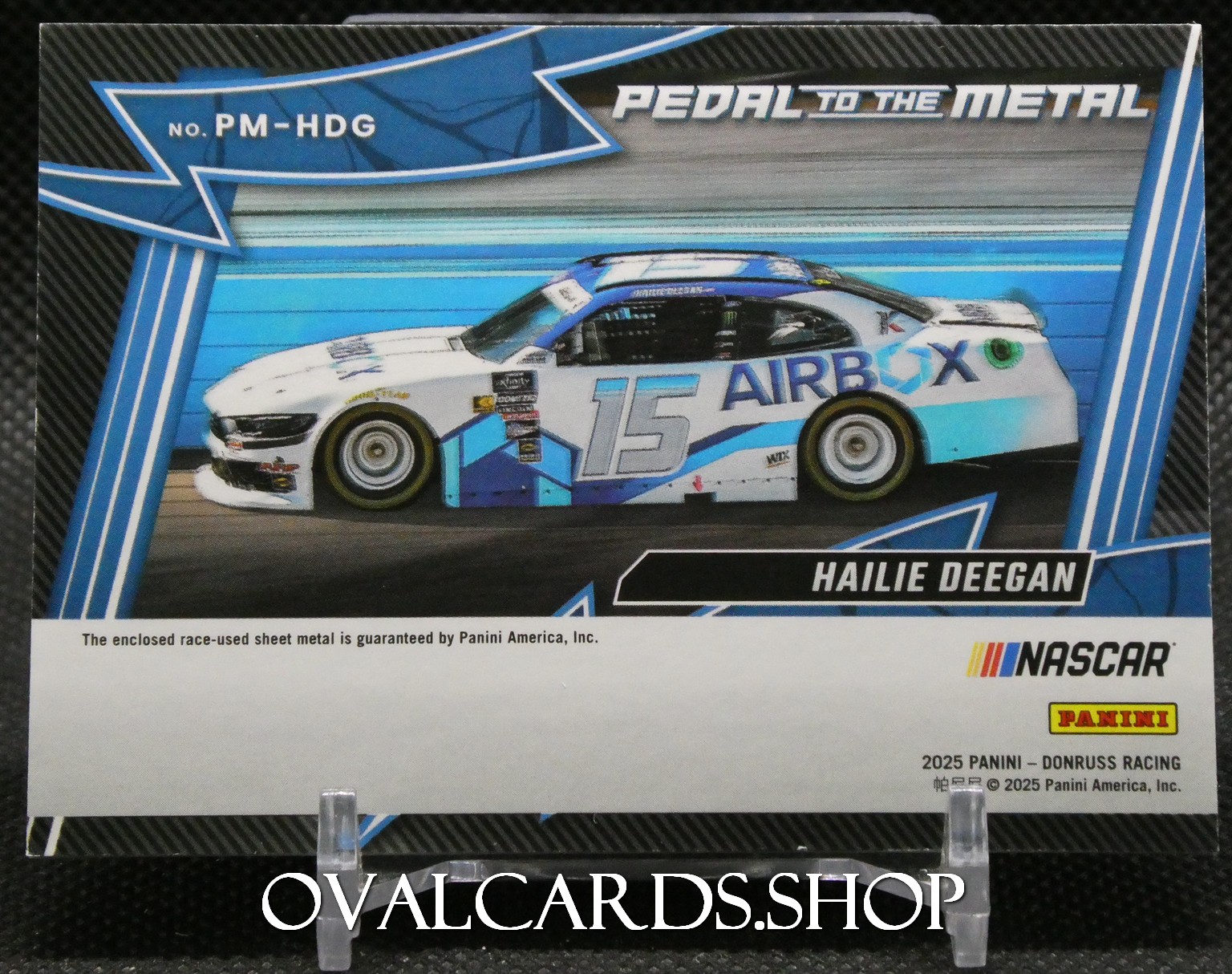 NASCAR Panini trading card showing Hailee Deegan's white-and-blue No. 15 race car with AIRBOX sponsorship on a blue track background and 'Pedal to the Metal' header.